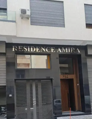 a building with a sign that reads resilience at SUPER HIGH 12 standing studio at Maarif in Maarif
