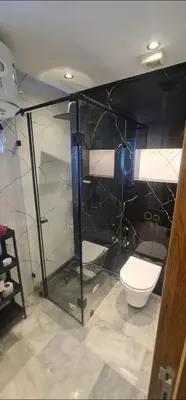 a bathroom with a glass shower and a toilet at SUPER HIGH 12 standing studio at Maarif in Maarif
