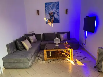 a living room with a couch and a table at Appartement Agdal in Rabat