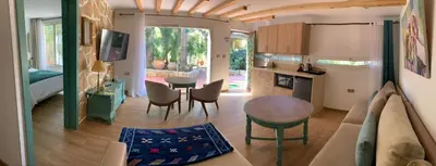 a living room with a couch and a table at Palmeraie 3 in Skhirat