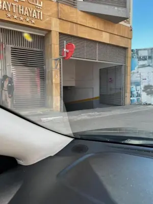 a view from a car windshield of a garage at Luxe & Confort in Cité de Bournazel