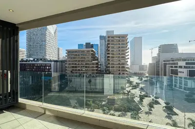 a balcony with a view of a city skyline at Luxury business 70m apartment -CFC AERIA Mall Casa in Casablanca