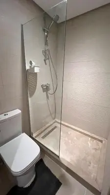 a bathroom with a shower and a toilet at N42 Luxe et Élégance avec Jacuzzi Privatif sur la Corniche Rabat Essabah in Rabat