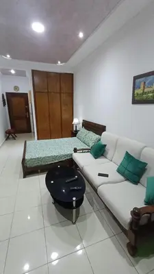 a living room with two beds and a couch at Studio confortable in Rabat