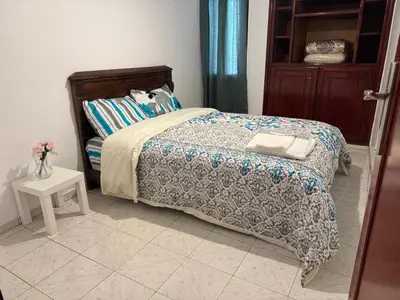 a bedroom with a bed and a vase of flowers at Hyatt Residence Casa Voyageur in Casablanca