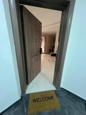 a door to a hallway with a welcome mat at Charmant studio in Casablanca