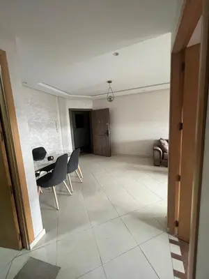 a living room with a table and chairs at Charmant studio in Casablanca