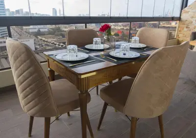 a dining room table with chairs and a large window at R104- Luxurious Penthouse with Incredible Sea View in Casablanca