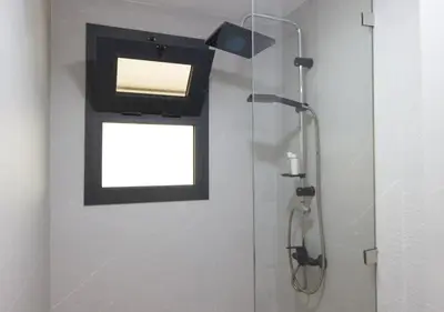 a bathroom with a shower with a tv on the wall at R104- Luxurious Penthouse with Incredible Sea View in Casablanca