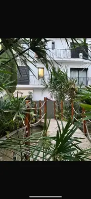 a building with a fence and plants in front of it at studio tout confort, près de la corniche Casablanca in Casablanca
