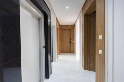 a hallway of a house with wooden doors at Acacia Studios in Casablanca