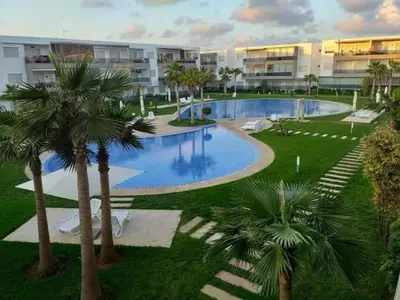 an image of a swimming pool at a resort at apart Blanca beach sur mer in Sidi Rahal