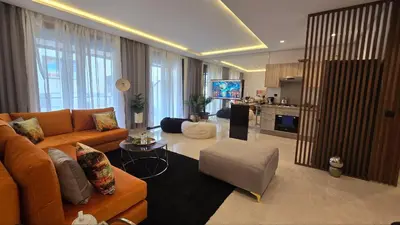 a large living room with a couch and a table at aeria mall studio en plein casa in Casablanca