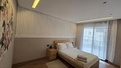 a small bedroom with a bed and a window at aeria mall studio en plein casa in Casablanca