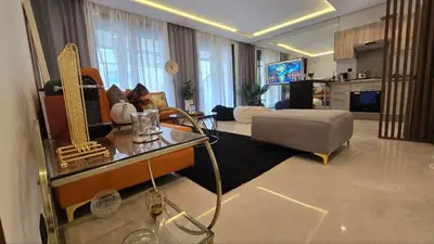 a living room with a couch and a table at aeria mall studio en plein casa in Casablanca
