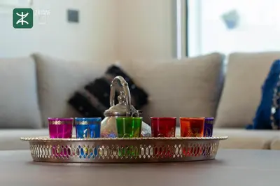 a tray of different colored glasses on a table at Beachside Retreat Rabat - Zayane Homes in Temara