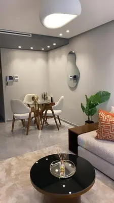 a living room with a couch and a table at Appartement à Casablanca Ferme bretonne OCP à 5min du CFC in Casablanca