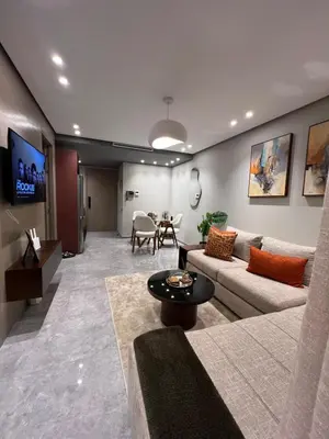 a living room with a couch and a table at Appartement à Casablanca Ferme bretonne OCP à 5min du CFC in Casablanca