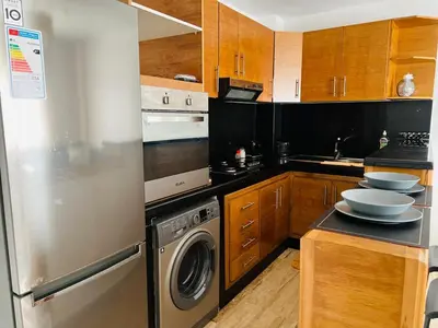 a kitchen with a dishwasher and a washer and dryer at Appartement centre de casablanca in Casablanca