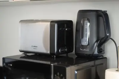 a microwave and a toaster sitting on top of a shelf at Premium Stay - Promenade Hassan II in Casablanca