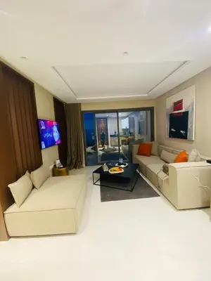 a living room with two couches and a tv at Atlantic Suite View 4 in Casablanca