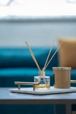 a table with a candle and chopsticks on a table at Charming Flat with Pool view Fast Wi-Fi in Bouznika