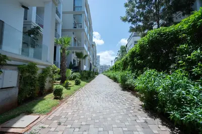 a cobblestone street in a city with buildings at Charming Flat with Pool view Fast Wi-Fi in Bouznika