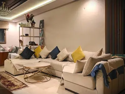 a living room with a couch with pillows on it at Joli appartement au centre-ville de Rabat in Rabat
