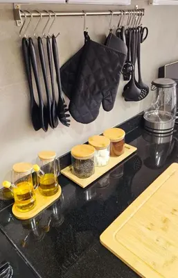 a kitchen counter with two trays of cooking utensils at Cosy Appartement Rabat Agdal in Rabat