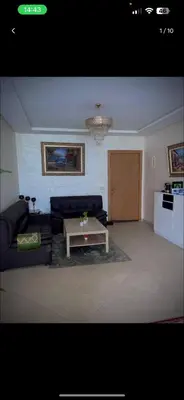 a living room with a couch and a coffee table at Mark in Temara