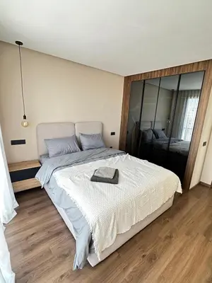 a bedroom with a bed with a tray on it at Studio Usio in Casablanca