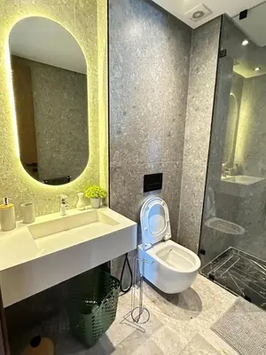 a bathroom with a sink and a toilet and a mirror at Studio Usio in Casablanca