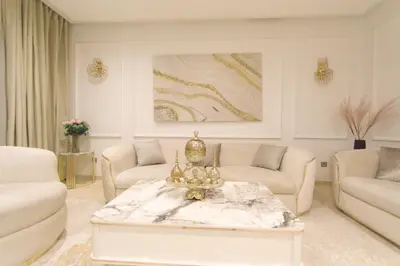 a living room with a couch and a coffee table at 165m luxury Family apartment in prestigia rabat in Rabat