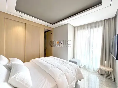 a bedroom with a white bed and a large window at TheBesty Ocean Suite -By Appart'Ayla in Anfa-Supérieur