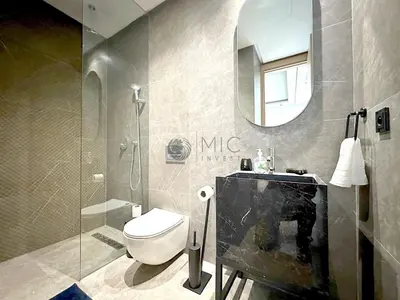 a bathroom with a toilet and a sink and a mirror at TheBesty Ocean Suite -By Appart'Ayla in Anfa-Supérieur
