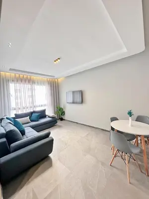 a living room with a couch and a table at familyconfort casa evasion in Casablanca