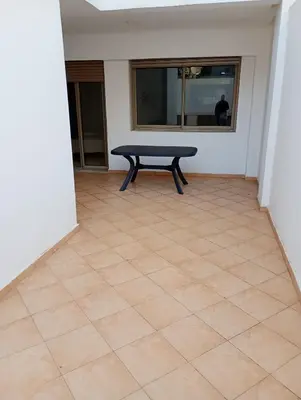 a bench sitting on a tiled floor in a room at Bati d or in Mohammedia