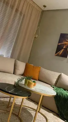 a living room with a couch and a table at Cosy C35 in Casablanca