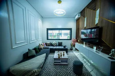 a living room with a couch and a tv at casablanca maroc in Casablanca