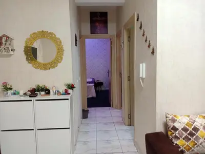 a hallway with a white cabinet and a mirror at confy house in Casablanca