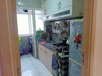 a kitchen with a stove and a refrigerator at confy house in Casablanca