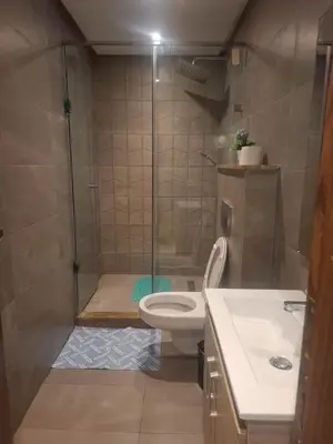 a bathroom with a shower with a toilet and a sink at Luxury studio 20 in Casablanca