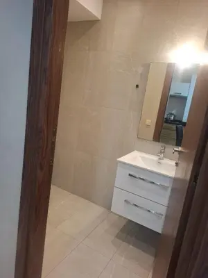 a bathroom with a sink and a mirror at Luxury studio 20 in Casablanca