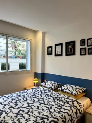 a bedroom with a bed and a window at 1 bed apt In Prestigia hay Riad rabat in Rabat