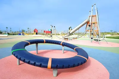 a playground with a large blue inflatable tube at Appt neuf Zenata- 2 chambres et Mezzanine - Piscine in Aïn Harrouda
