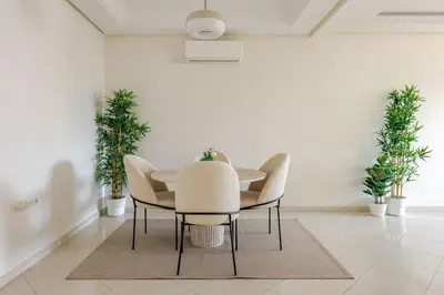 a dining room with a table and chairs at Rabat Centro Apartments in Rabat