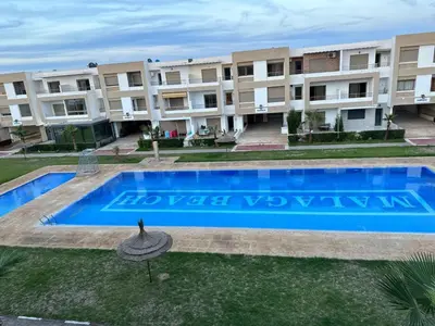 an image of an apartment complex with a swimming pool at Appartement Alaa in Mansouria