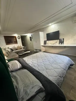 a bedroom with a large bed in a room at شقة فأكدال in Rabat