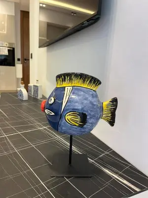 a statue of a blue fish on a stand in a room at Cocon au coeur de Casablanca in Casablanca
