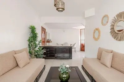 a living room with two couches and a table at Spacious 2Bedrooms Fully equipped-5min Agdal Station in Rabat